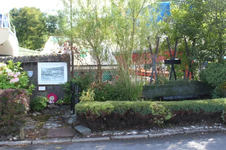 Contextual view of plaque within the garden