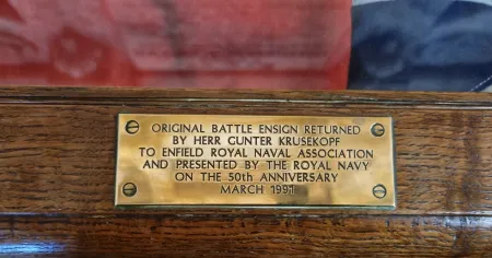 Plaque under the battle ensign