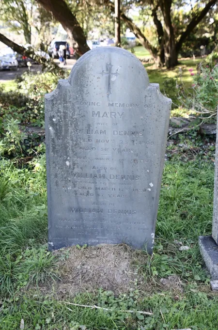 Front of gothic-topped gravestone with incised inscription
