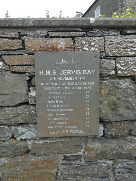 Stone tablet mounted on stone wall