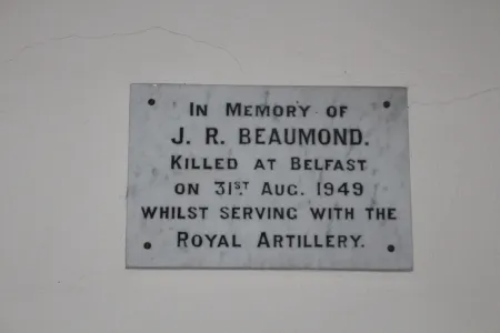 Plaque in memory of J R Beaumond
