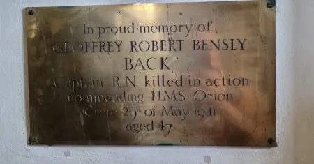 A brass plaque commemoration the death of the subject and the circumstances.