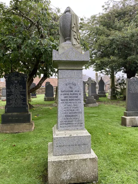 Pillar topped with a draped urn
