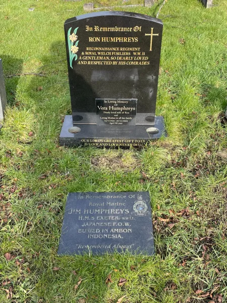 Horizontal stone in front of family gravestone