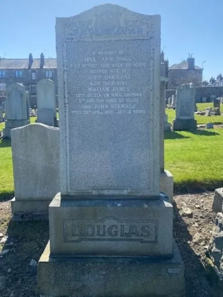 Granite gravestone with "DOUGLAS" along the base
