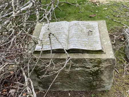 Granite gravestone shaped like an open book