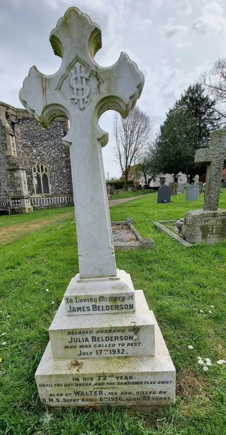 A stone gravestone with a fleury top cross on three steps with one name in addition to that remembered