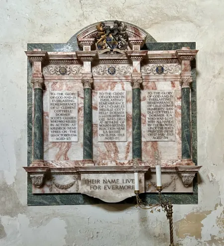 Three incised panels with family coat of arms at top