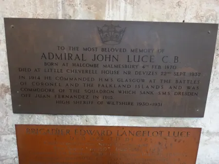 Dark metal plaque with engraved crown and wording commemorating Admiral Luce