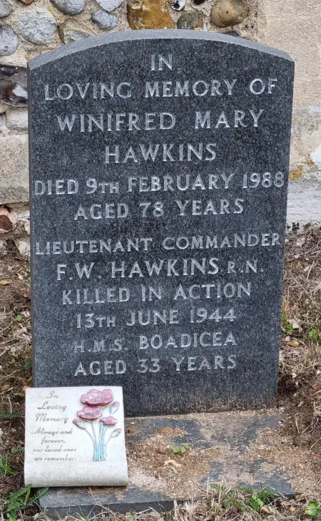 A marble gravestone with a shallow curved top
