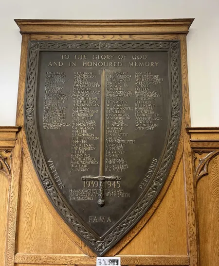 Bronze shield mounted on a wooden board