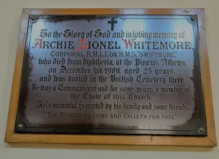 Plaque commemorating the death of Corporal Archie Lionel Whitemore at Piraeus Athens in St James Church West End Hampshire