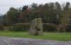 Memorial of rough square-shaped stones piled into a massive monument.