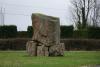 Memorial of rough square-shaped stones piled into a massive monument.