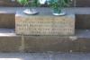 Memorial stone placed on the steps of the cross. 