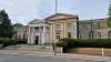Large stone columned gatehouse at front of Mill Hill School