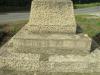 Dedication on plinth and steps