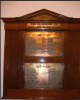 Wooden board with brass plaques for names