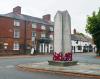 Obelisk with town buildings in background