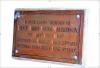 Brass plaque seen from a 45 degrees angle.