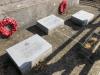 Three memorial tablets with poppy wreaths