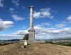 Column on hilltop overlooking countryside