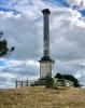 Column on hilltop with surrounding fence