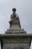 Sculpted figure atop column