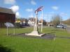 White stone cross on stepped base.