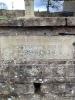 Tablet on front wall of garden