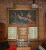 COPY PAINTING OF FRANCIA'S PIETA SET WITHIN A LARGE WOODEN FRAME WITH INSCRIPTIONS ABOVE AND BELOW IT. AT THE BOTTOM CORNERS ARE NAMES IN BLACK TEXT PAINTED ONTO TWO WHITE BACKGROUNDS.