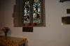 Image of memorial under window in church