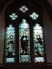 Stain glass window above memorial showing position