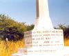 Memorial cross on octagonal base.