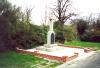 White Celtic cross on a rectangular base.