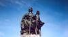 Statue on top of memorial.