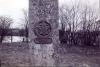 Star shaped metal plaque fixed to side of obelisk.