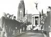 People stood in front of memorial.