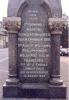 Tablet with engraved inscription on the side of the memorial. 