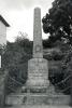 Obelisk with chain in front of it.