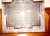 Plaque on a marble backboard.