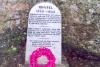 Stone with inscription.