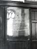 Brass plaque with inscription.