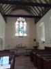 View of stained glass window behind chapel altar