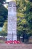 Memorial with railings and wreaths.