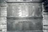 Metal panels with lists of names in raised lettering.