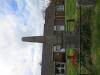 Obelisk and a building in the background.