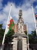 Figure of Britannia with sheathed sword and banner, on square pedestal and tapering obelisk, on three stepped base.