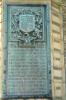 Plaque with raised lettering.