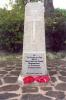 Memorial with wreaths laid at its base.